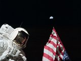 Astronaut_Harrison_'Jack'_Schmitt,_American_Flag,_and_Earth_(Apollo_17_EVA-1).jpg